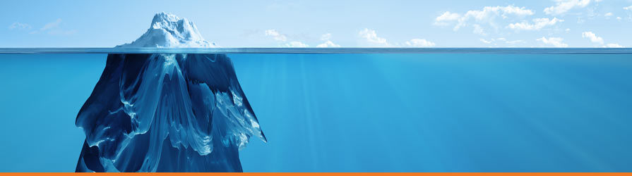 Distant underwater view of an iceberg with a small above water section, and a large below water view.